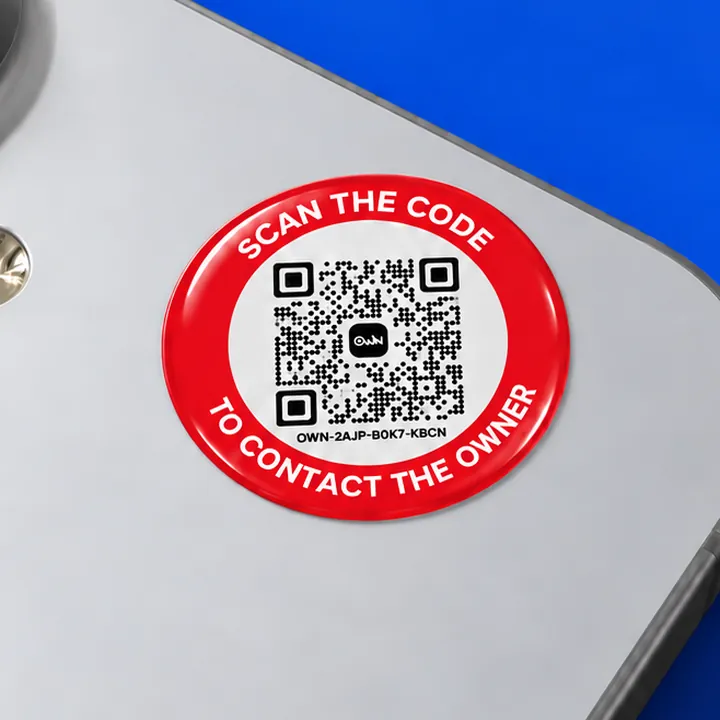 An OWN sticker on the back of a phone, in the camera's frame